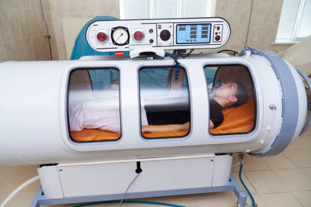 Patient receiving hyperbaric oxygen therapy treatment